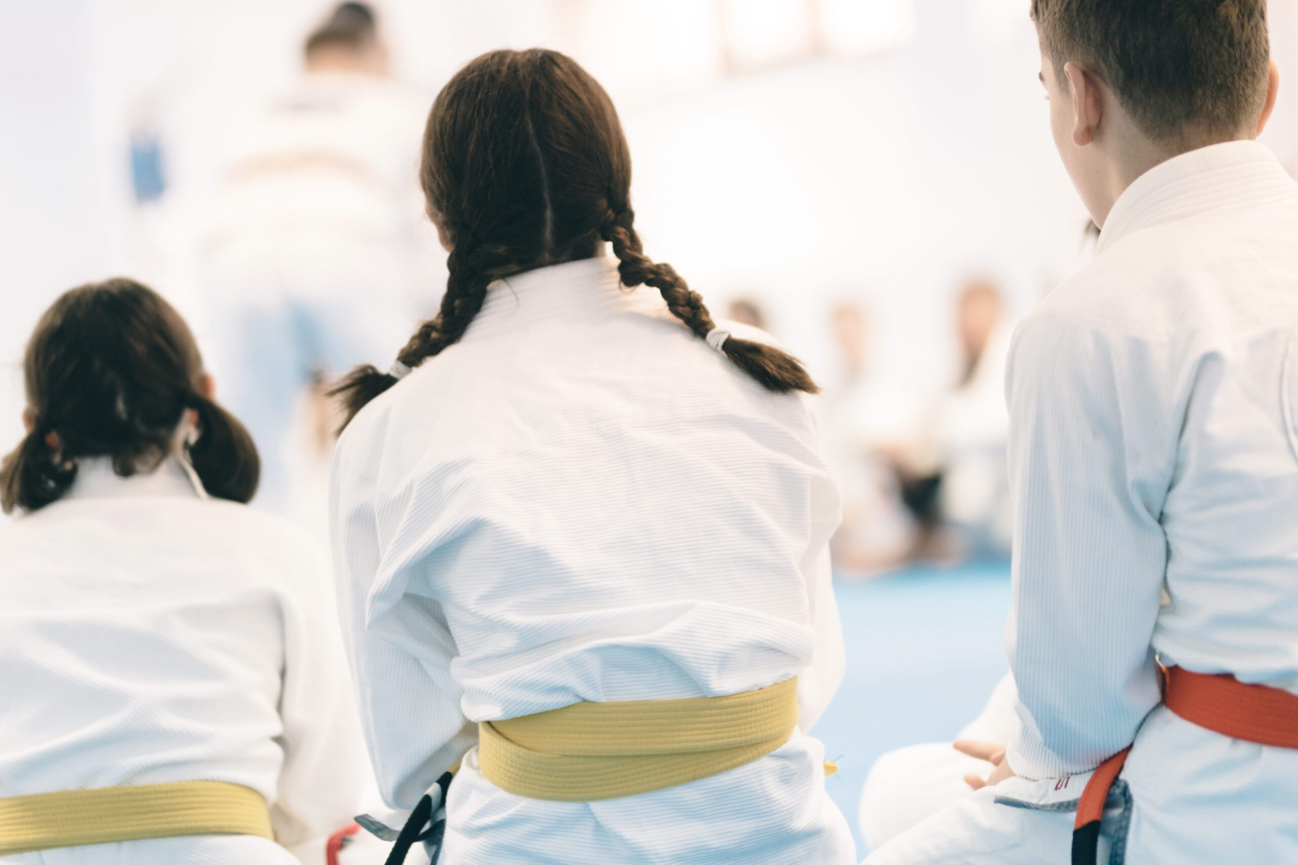 Kids sitting in martial arts class 
